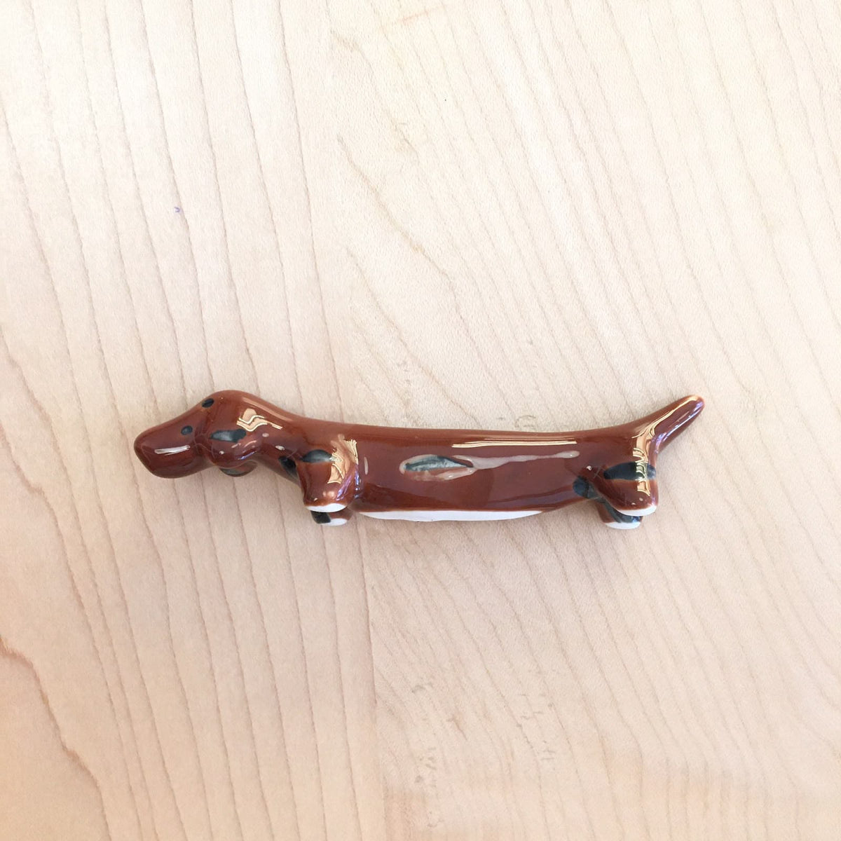 Soporte de palillos - perro salchicha -